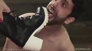The muscled dominatrix beats and dominates her slaveboy in a match