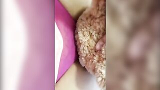 A girl is humping a teddy bear and masturbating