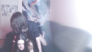 A couple enjoys intimate moments to the sound of music on their couch