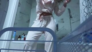 A cute petite girl wanking her pussy in the bathroom, no one sees it