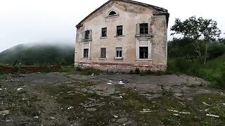 An exhibitionist girl is walking in a ruin with her hot girlfriend