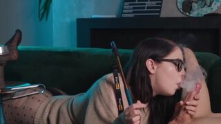 A cute nerdy girl with glasses gets fucked in 69 position and smokes a cigarette