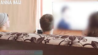 A babe has a risky sex with a friend on the couch and almost gets caught