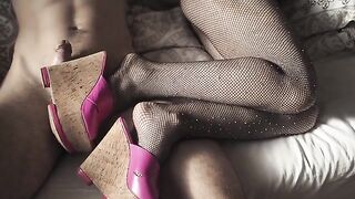 A hot chick in fishnet stockings and high heels is waiting for a hard cock