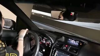 Cute girl fucks with a guy in the car in the parking lot