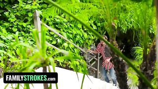 Two playful teens caught in a compromising 4th of July scene