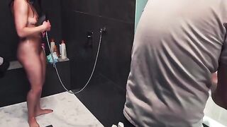 A guy gets his dick sucked off in the shower by a naughty woman