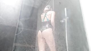 The girl has a wet pussy orgasm in the shower from masturbation