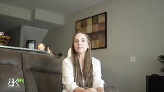 Stepmom shares a couch with her stepson in a steamy scene