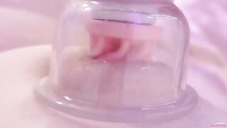 A girl plays with her nipples and clit using a toy, reaching intense pleasure
