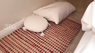 A girl is sharing a bed with her friend who has some wild habits
