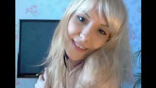 The blonde caresses her fingers with her pussy in a sensual solo act