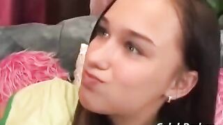 A young cute girl has sex with an adult man on the couch