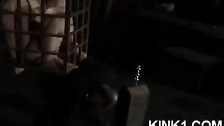 A slave in a cage satisfies all the master's orders