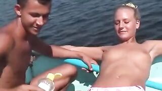 Sexual young people are fucking on the riverbank in a debauched way