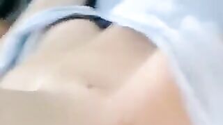 A half-naked lie and stroking her body with her hands