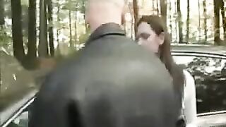 A girl was placed on the car bonnet and started to tear her clothes