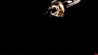 Someone is being taken in a rough way in the dark