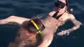 Underwater sex with aqualung divers at the bottom of the sea