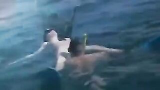 Underwater sex with aqualung divers at the bottom of the sea
