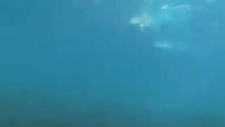 Underwater sex with aqualung divers at the bottom of the sea
