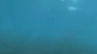 Underwater sex with aqualung divers at the bottom of the sea