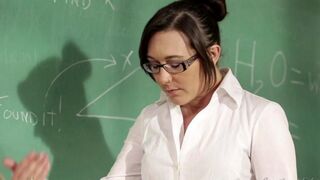 The girl is having fun with her teacher at her desk