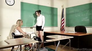 The girl is having fun with her teacher at her desk