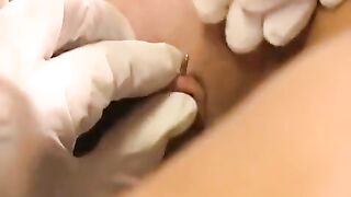Woman plays with her new clit piercing for the first time