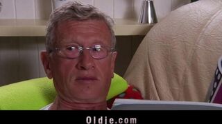 A hot blonde is getting fucked by an older man on the couch