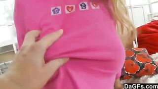 A cute 18-year-old blonde plays with her favorite sex toys on the bed