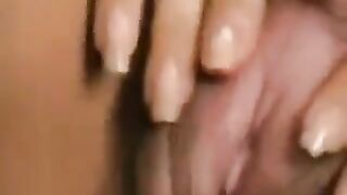 Girl caresses her hairy pussy with a big clitoris