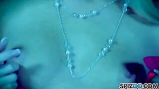 A blonde girl masturbating with a dildo in her pussy