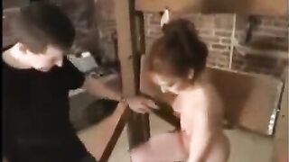 A sexy girl in bondage, subjected to sadistic and masochistic sex