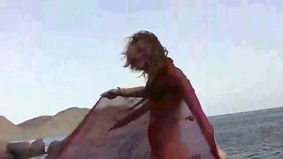 Nude girl on the beach with small boobs gets spanked