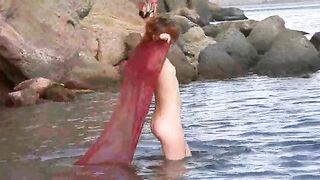 Nude girl on the beach with small boobs gets spanked