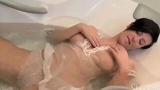 Brunette with long hair masturbating herself in the shower