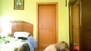 A pervert guy peeps on a girl undressing in her room