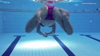 A little naked beauty swimming in the pool