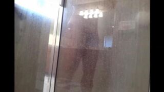 The man washes his body in the shower, camera records
