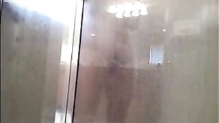 The man washes his body in the shower, camera records
