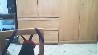 A woman fucks in front of her husband's webcam