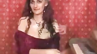 A girl with natural big tits plays with her hairy pussy