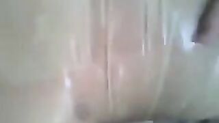 Putting a condom on a cock and jerking it