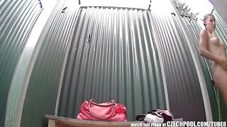 A girl has a shower and someone films her with a hidden camera