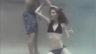 The guy fucks the red-haired swimmer in the pool