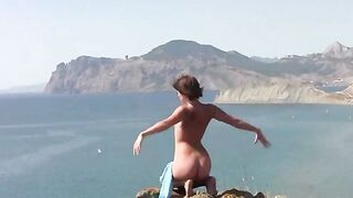 A beauty in different poses naked on the beautiful beach