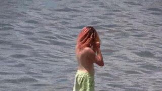 A bunch of nudists are having fun on the beach in Crimea