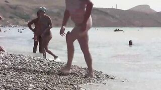 A bunch of nudists are having fun on the beach in Crimea