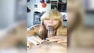A black woman demonstrates her skills in using a condom on a member